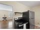 Cozy kitchen featuring stainless steel appliances and hardwood floors at 343 Wakefield Dr # B, Charlotte, NC 28209