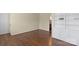 Bright living room featuring hardwood floors, neutral walls, and built in shelving at 343 Wakefield Dr # B, Charlotte, NC 28209