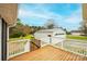 Expansive wooden deck offers a picturesque view of the detached garage and surrounding landscape at 3628 Laney Rd, Maiden, NC 28650