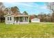 Charming, renovated bungalow with quaint front porch and detached garage on a sprawling lot at 3628 Laney Rd, Maiden, NC 28650