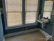 Compact bathroom with window and pedestal sink at 415 W Warren St, Shelby, NC 28150