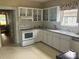 Functional kitchen with appliances and cabinetry at 415 W Warren St, Shelby, NC 28150