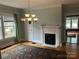 Cozy living room with fireplace and large windows at 415 W Warren St, Shelby, NC 28150