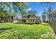 A home has a spacious backyard with plenty of room to play and entertain at 4221 Lake Shore S Rd, Denver, NC 28037