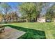 Spacious backyard with green grass, a shed, and partial fencing at 4221 Lake Shore S Rd, Denver, NC 28037