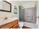 A bathroom featuring wood-look flooring, a shower/tub combo, and a matching vanity at 4221 Lake Shore S Rd, Denver, NC 28037