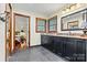 A bathroom features a double vanity with dark cabinetry and stylish fixtures at 4221 Lake Shore S Rd, Denver, NC 28037