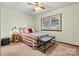 A cozy bedroom features a colorful striped bedspread and a comfortable seating area at 4221 Lake Shore S Rd, Denver, NC 28037