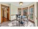 Breakfast nook with bay window and wooden trim with tile floors at 4221 Lake Shore S Rd, Denver, NC 28037