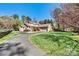 Inviting brick home with a long drive, mature landscaping, and an attached two car garage at 4221 Lake Shore S Rd, Denver, NC 28037
