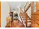 Welcoming foyer with wood floors, a staircase, and a view of the cozy living room at 4221 Lake Shore S Rd, Denver, NC 28037
