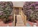 Inviting front entrance with brick steps, blooming shrubs, and a classic wooden door at 4221 Lake Shore S Rd, Denver, NC 28037