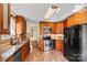 Bright eat-in kitchen featuring stainless steel appliances, tile floors, and stone countertops at 4221 Lake Shore S Rd, Denver, NC 28037
