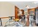 Eat in kitchen with stainless steel appliances, mosaic backsplash, and glass table at 4221 Lake Shore S Rd, Denver, NC 28037