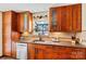 Kitchen featuring stainless steel dishwasher, mosaic backsplash, and stone countertops at 4221 Lake Shore S Rd, Denver, NC 28037