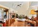 Well-lit living room with hardwood floors, fireplace, ceiling fan, and access to the sun room at 4221 Lake Shore S Rd, Denver, NC 28037