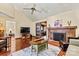 Spacious living room with a fireplace, seating, tv, and hardwood floors at 4221 Lake Shore S Rd, Denver, NC 28037