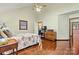 Comfortable main bedroom featuring wood floors, a ceiling fan, and a tranquil atmosphere at 4221 Lake Shore S Rd, Denver, NC 28037