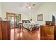 Spacious main bedroom with wood floors, vaulted ceiling, and a private balcony at 4221 Lake Shore S Rd, Denver, NC 28037