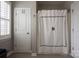 Bathroom featuring a shower and tub combination with decorative curtain and neutral walls at 4225 Jasmin May Dr, Charlotte, NC 28226