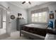 Bedroom features a grey bed, a grey dresser, and a window with natural light shining through at 4225 Jasmin May Dr, Charlotte, NC 28226