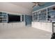 Bonus room with custom built-in shelving units and cabinets offering ample storage and display space at 4225 Jasmin May Dr, Charlotte, NC 28226