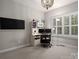 Bright office space with plantation shutters, neutral walls and chandelier lighting at 4225 Jasmin May Dr, Charlotte, NC 28226
