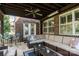 Relaxing covered patio featuring a plush sectional, dining, and bar seating at 4225 Jasmin May Dr, Charlotte, NC 28226