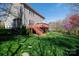 Spacious backyard with a wooden deck and lush lawn, ideal for outdoor gatherings and relaxation at 4232 Belle Meade Cir, Belmont, NC 28012