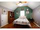 Unique bedroom with an interesting colour scheme, hardwood flooring and a window at 4232 Belle Meade Cir, Belmont, NC 28012