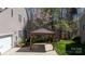 Attached covered carport providing protection for vehicles next to a home with light siding at 4232 Belle Meade Cir, Belmont, NC 28012