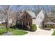 Charming brick home with a well-manicured lawn, mature trees, and inviting curb appeal at 4232 Belle Meade Cir, Belmont, NC 28012