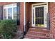 Welcoming front porch with brick stairs, a decorative door, and a 'Welcome' sign, creating a warm entrance at 4232 Belle Meade Cir, Belmont, NC 28012