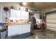 Spacious garage with an organized workbench, storage cabinets, and ample lighting at 4232 Belle Meade Cir, Belmont, NC 28012