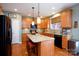 Spacious kitchen with an island, modern appliances, granite countertops, and eat in bar seating at 4232 Belle Meade Cir, Belmont, NC 28012