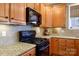 Updated kitchen featuring granite countertops, modern appliances, and wood cabinetry at 4232 Belle Meade Cir, Belmont, NC 28012