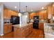 Well-equipped kitchen with granite countertops, stainless appliances, and wood cabinetry at 4232 Belle Meade Cir, Belmont, NC 28012