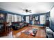 Comfortable media room with leather sofa, hardwood floors, and vibrant decor at 4232 Belle Meade Cir, Belmont, NC 28012