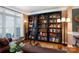 Inviting living room with built-in bookcase, wood floors, neutral walls and comfortable seating at 4232 Belle Meade Cir, Belmont, NC 28012