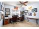 Well-lit office space with dual desks, ceiling fan, and decorated walls at 4232 Belle Meade Cir, Belmont, NC 28012