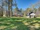 A spacious backyard featuring a storage shed and partial fencing offers ample space at 4522 Chuckwood Dr, Mint Hill, NC 28227