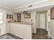 Finished basement bar with stone countertops, a sink, and custom lighting at 4522 Chuckwood Dr, Mint Hill, NC 28227