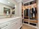 Bathroom featuring white cabinetry, modern fixtures, and custom built-in storage at 4522 Chuckwood Dr, Mint Hill, NC 28227