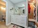 Updated bathroom with a modern vanity, gold-trimmed mirror, and built-in dressing area at 4522 Chuckwood Dr, Mint Hill, NC 28227