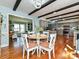 Open-concept dining room with hardwood floors, seamlessly connected to the kitchen and living spaces at 4522 Chuckwood Dr, Mint Hill, NC 28227