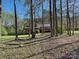 A home nestled among mature trees, offering privacy and natural beauty at 4522 Chuckwood Dr, Mint Hill, NC 28227