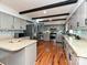 Modern kitchen with gray cabinets, stainless steel appliances, and tiled backsplash at 4522 Chuckwood Dr, Mint Hill, NC 28227