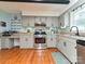 Functional kitchen with stainless steel appliances, ample cabinet space, and hardwood flooring at 4522 Chuckwood Dr, Mint Hill, NC 28227