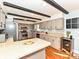 Well-equipped kitchen with gray cabinetry, modern appliances, and stylish backsplash at 4522 Chuckwood Dr, Mint Hill, NC 28227