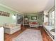 Cozy living room with built-in shelving, window seating, and a comfortable seating arrangement at 4522 Chuckwood Dr, Mint Hill, NC 28227